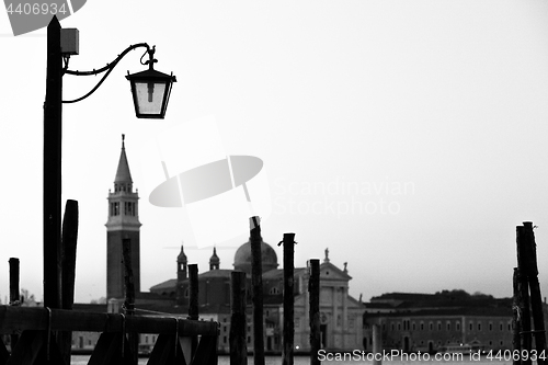 Image of Street lamp silhouette in Venice, Italy at sunrise