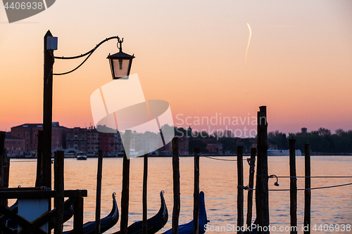 Image of Street lamp and gondolas in Venice, Italy
