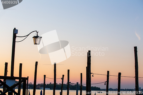 Image of Street lamp silhouette in Venice, Italy at sunrise