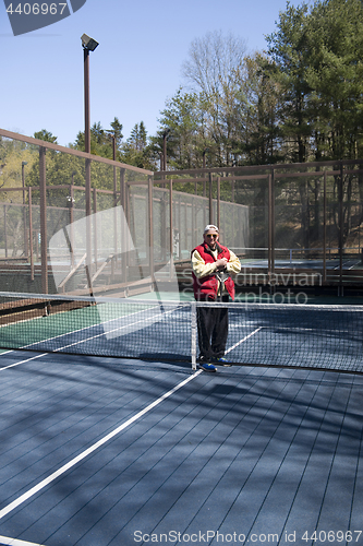 Image of happy senior athlete  platform tennis paddle court