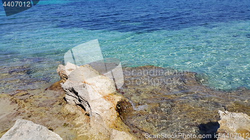 Image of Bright turquoise sea water and coastal rocks