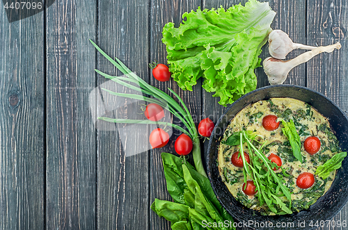 Image of Fritatta with tomatoes and ingredients