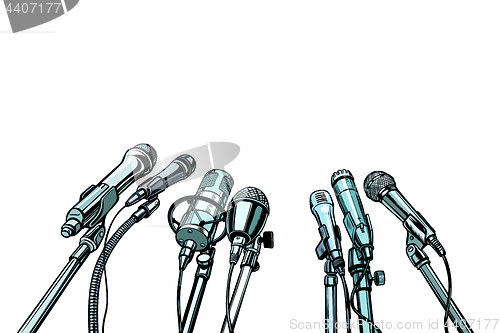 Image of many microphones interview background