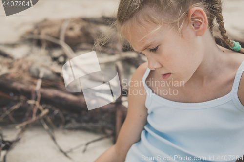 Image of Portrait of one sad little girl.