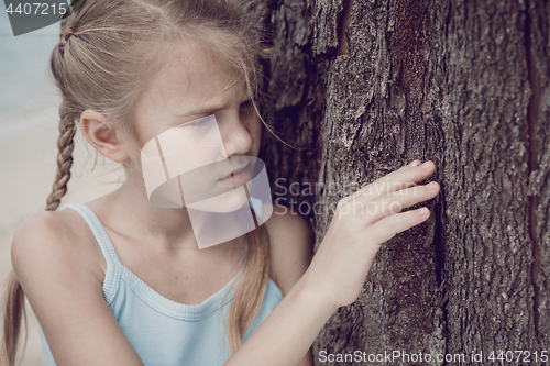 Image of Portrait of one sad little girl.