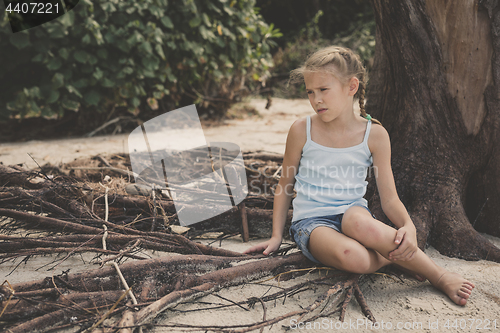 Image of Portrait of one sad little girl.