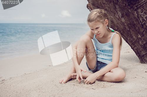 Image of Portrait of one sad little girl.