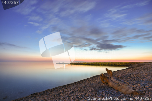 Image of Seascape, snag on the seashore, in the background breakwater, Black Sea, Small Bay, Anapa, Russia