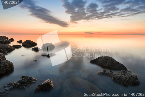 Image of Calm sea of rocky beach of the Black Sea after sunset, Anapa, Russia