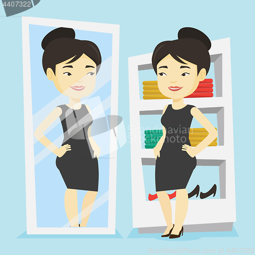 Image of Woman trying on clothes in dressing room.