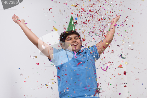 Image of kid blowing confetti