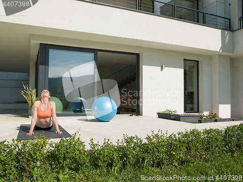 Image of woman doing morning yoga exercises