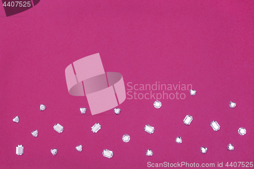 Image of Rhinestones on vibrant magenta background