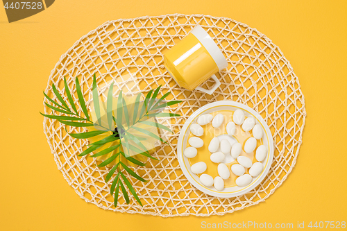 Image of Teacup, white chocolate and palm tree leaves