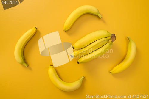 Image of Bananas on bright yellow background