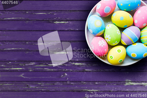 Image of close up of colored easter eggs on plate