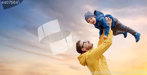 Image of father with son playing and having fun outdoors