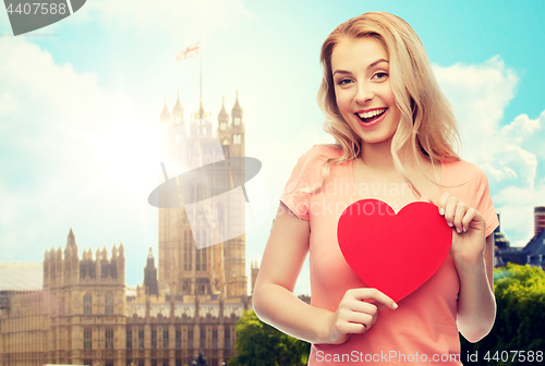 Image of happy woman or teen girl with red heart shape