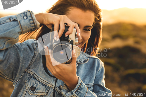 Image of Woman Taking Picture Outdoors