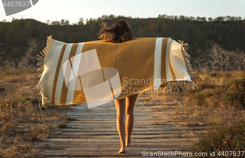 Image of Beautiful woman wrapped in a wool towel