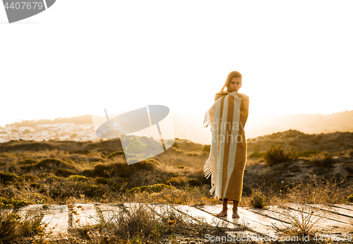 Image of Beautiful woman wrapped in a wool towel