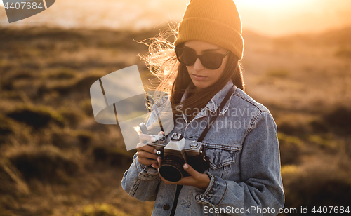 Image of Woman Taking Picture Outdoors