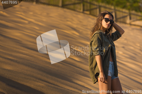 Image of Woman at a sand dune