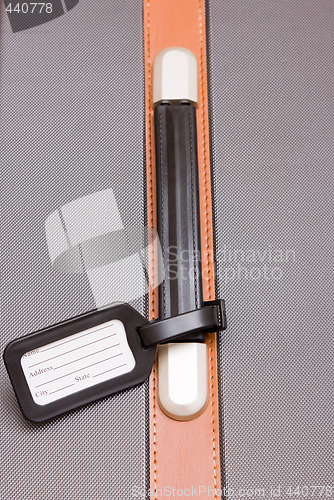 Image of Black Luggage Tag On Baggage