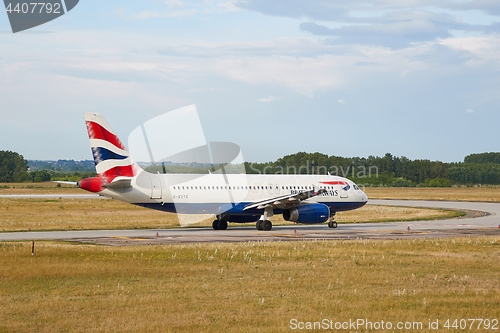 Image of Plane rolling on a taxiway