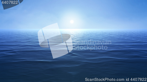 Image of a blue ocean with sun over the horizon
