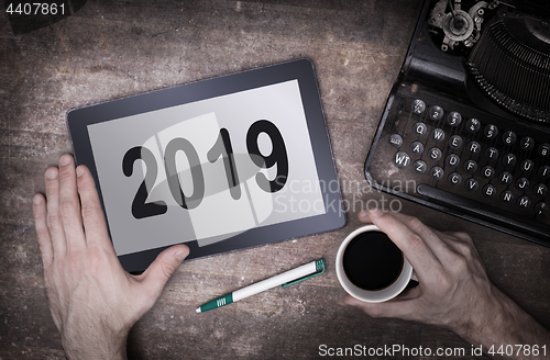 Image of Tablet touch computer gadget on wooden table - 2019