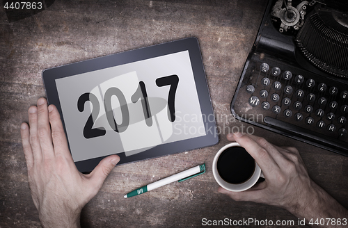 Image of Tablet touch computer gadget on wooden table - 2017