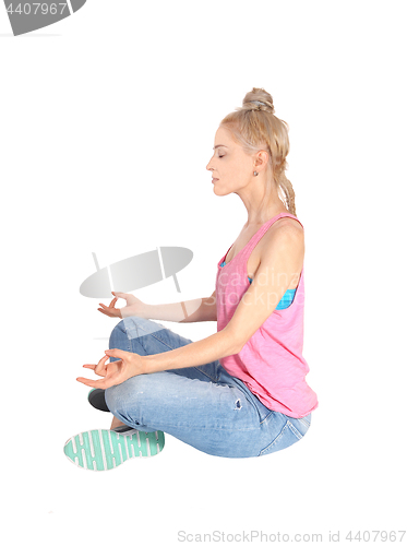 Image of Young woman in yoga pose