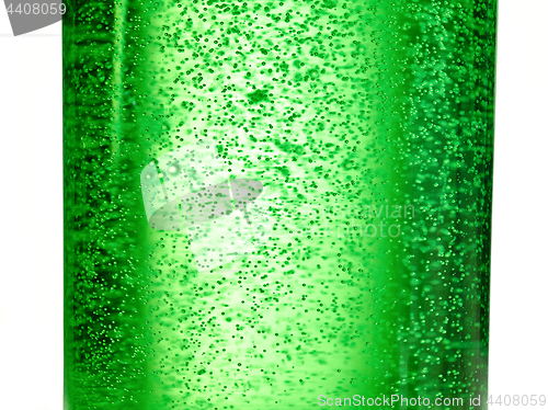 Image of abstract background : bubble of sparkling water soda on the green glass bottle with gradient light