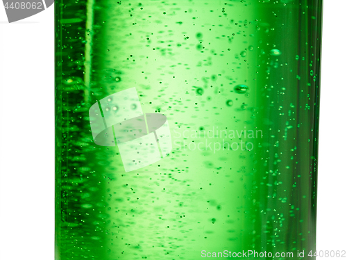 Image of abstract background : bubble of sparkling water soda on the green glass bottle with gradient light