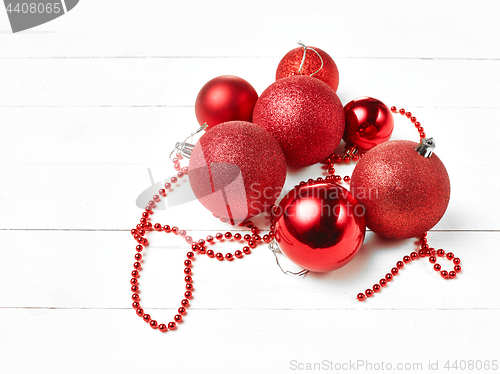 Image of three red christmas balls isolated on white background