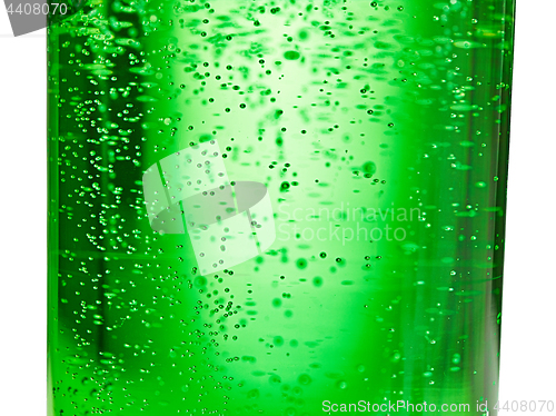 Image of abstract background : bubble of sparkling water soda on the green glass bottle with gradient light