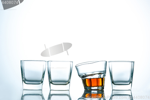 Image of The curved glass of whiskey or alcohol drink