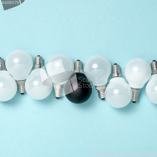 Image of One light bulb outstanding,glowing different.business creativity