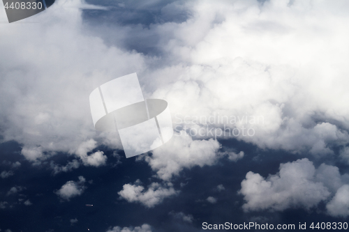 Image of Sunrise above clouds from airplane window