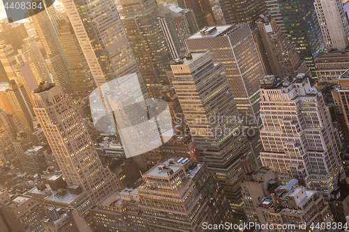 Image of New York City skyline with urban skyscrapers at sunset, USA.