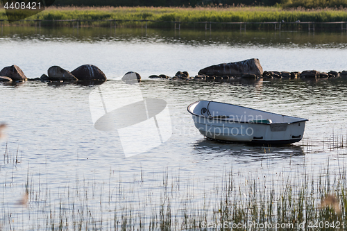 Image of Lone row boat by the coast