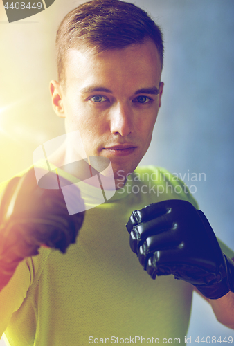 Image of young man in boxing gloves