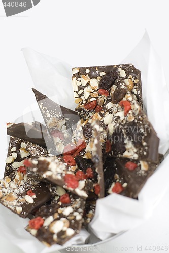 Image of chocolate slices with berries and nuts