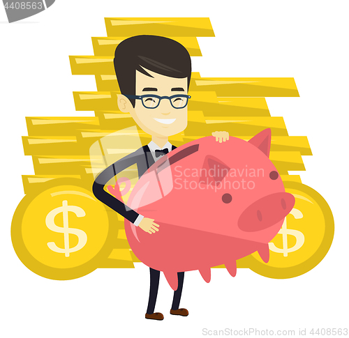 Image of Business man holding big piggy bank.