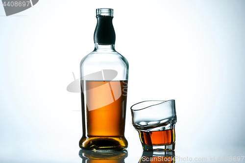 Image of The curved glass of whiskey or alcohol drink