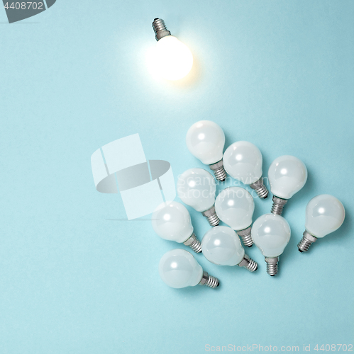 Image of One light bulb outstanding, glowing different. Business creativity idea concepts.