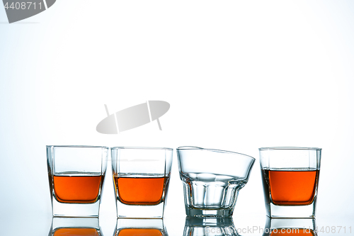 Image of The curved glass of whiskey or alcohol drink