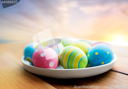 Image of close up of colored easter eggs on plate