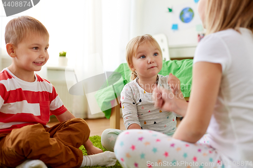 Image of kids playing rock-paper-scissors game at home